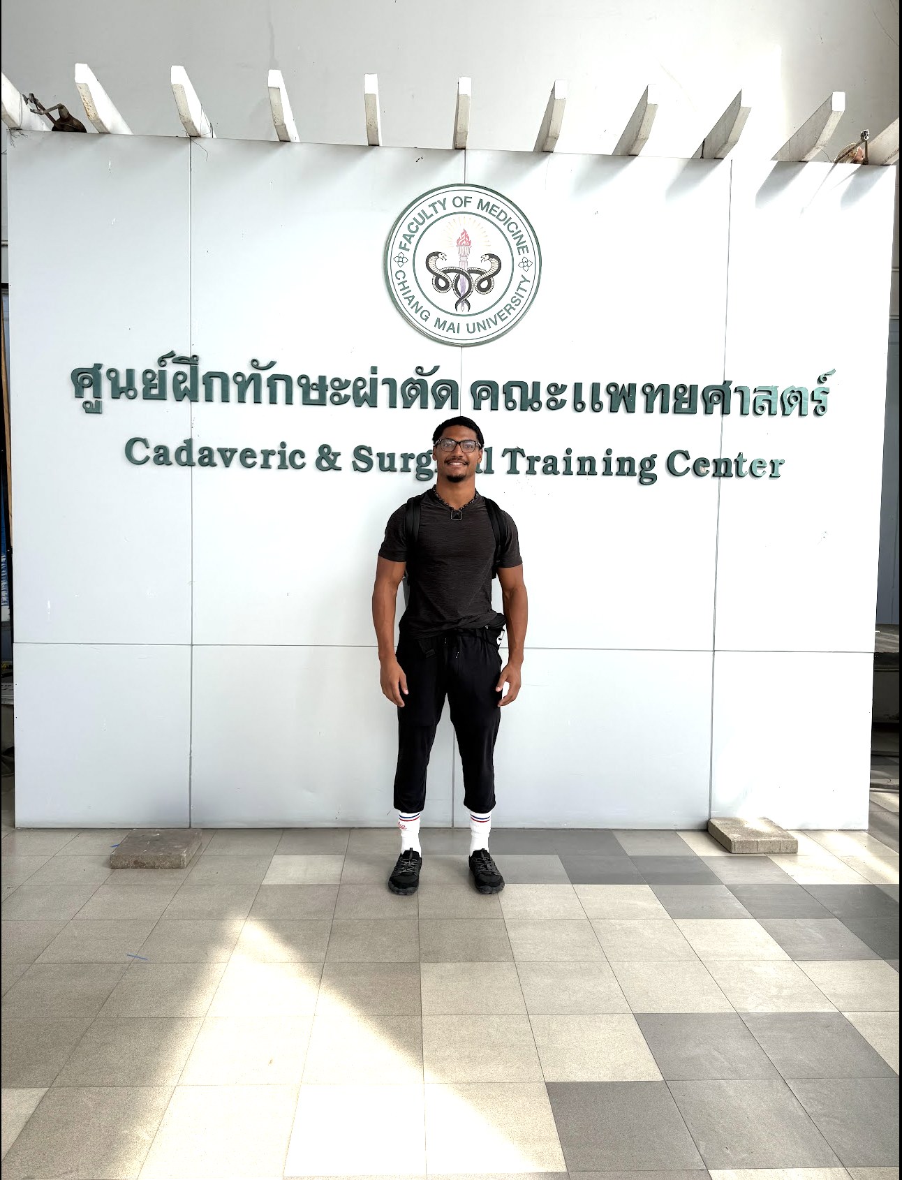 Elijah Naylor Jr. standing outside a cadaveric and surgical training center