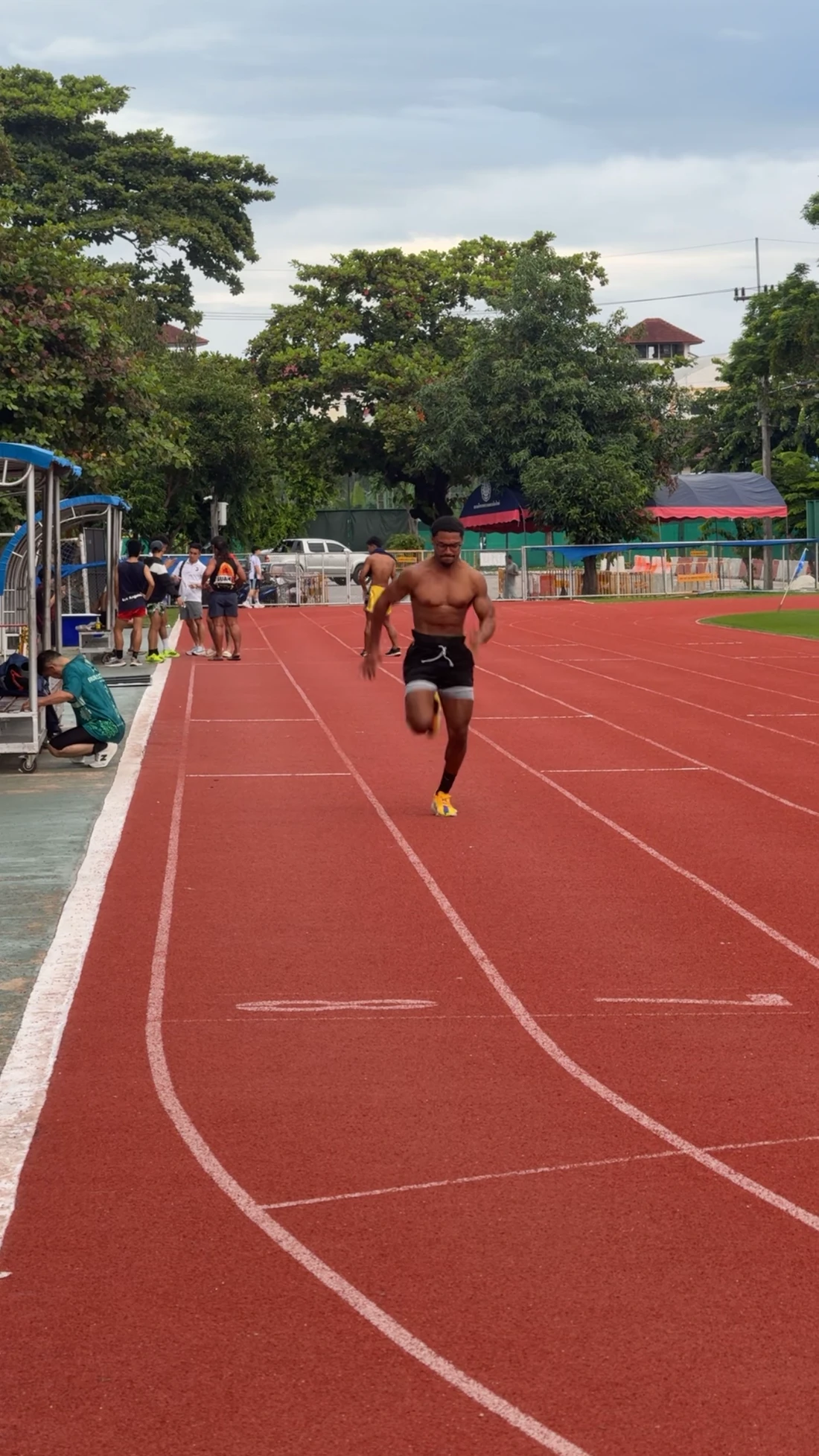 Elijah sprinting on an outdoor running track